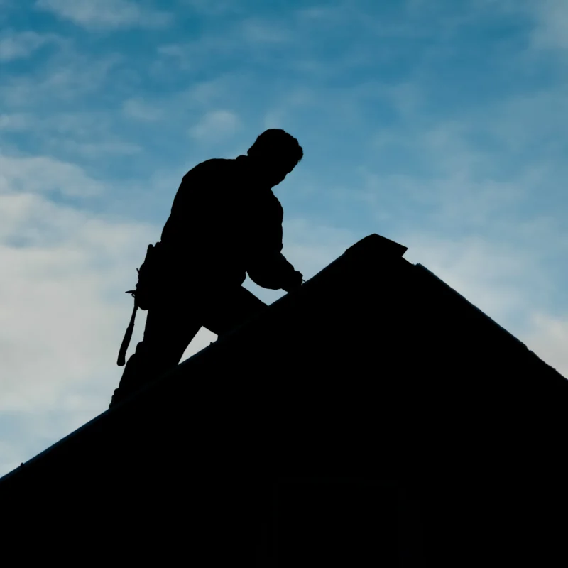 Contractor In Silhouette Working On A Roof Top 2023 11 27 05 05 52 Utc