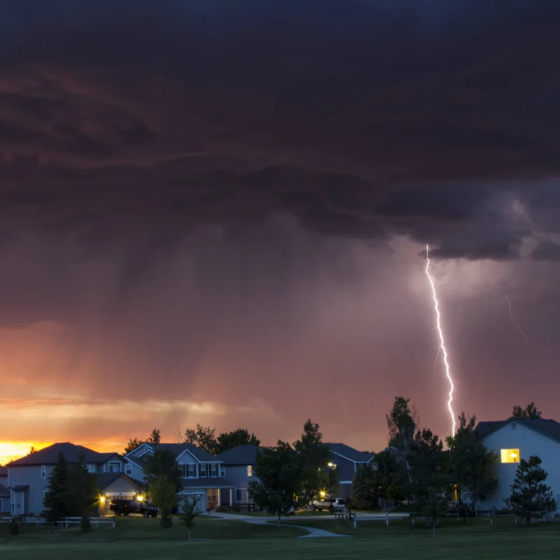 Lightning Strikes Behind Houses At Sunset 2024 06 25 17 36 26 Utc